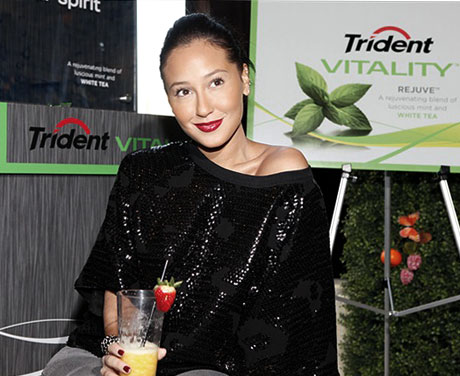 Adrienne Bailon enjoys an Awaken smoothie at the Trident Vitality launch