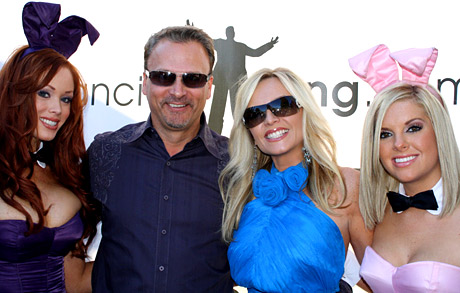 Tamry Barney of "The Real Housewives of Orange County and husband Simon, who says he's really the 6th housewife, pose with bunnies.