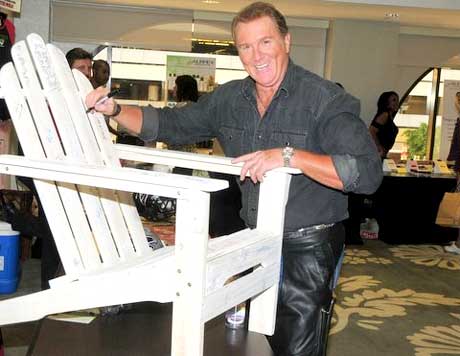 Michael McGrady signing the Project Green chair. 