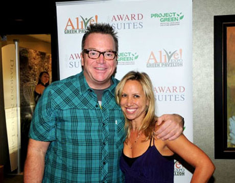 Tom Arnold and Stacy Broff happily showing support in going green.