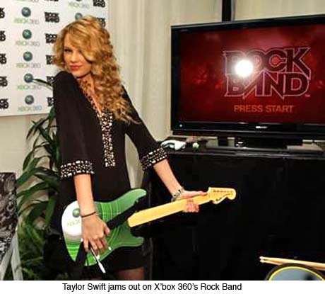Taylor Swift playing Xbox 360 Rock Band