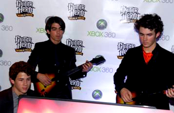 Jonas Brothers test out the new Guitar Hero.