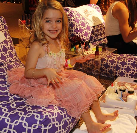 Little actress Grace McKenny getting her tiny nails polished in the mini spa.