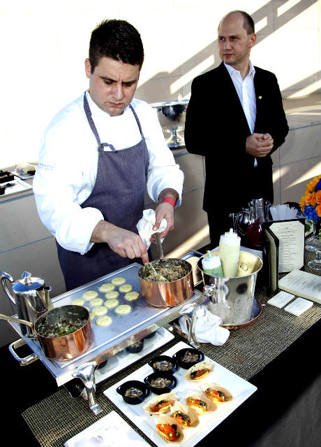Brandon Weaver, Chef de Cuisine of The Roof Garden, The Peninsula Beverly Hills prepares Truffle Macaroni and Cheese from the Suite 100 special menu.