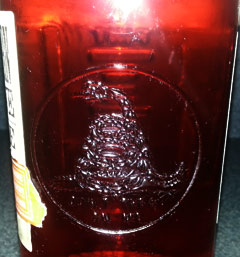 The "Don't Tread on Me" emblem on the side of  a 'jar' of American Born Moonshine.