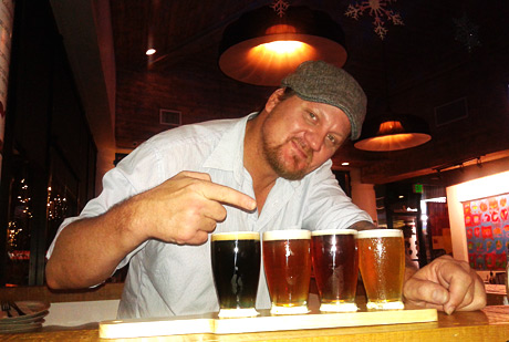 Cliff Williams, bar manager of Orlando's, with a delightful flight of different draft beers.