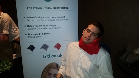 Tyler Emery demonstrating the support of the Trtl Pillow!