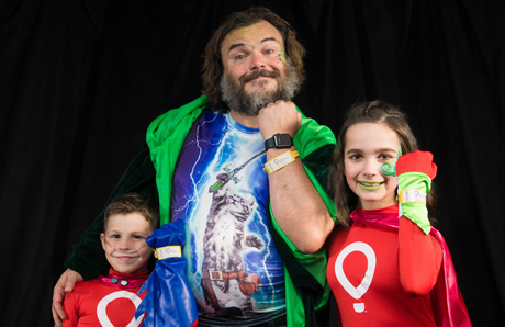 Jack Black with Miracle kids Nathan Ferrell and Jessica Meyer. Photo by Andy Halbeck