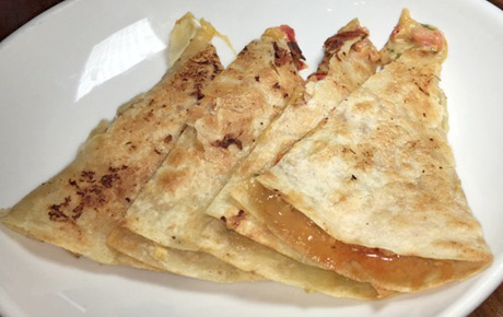 FishBar's Lobster Stuffed Quesadilla has delicate lobster meat nestled between decadent cheese in a flour tortilla. Delicious!