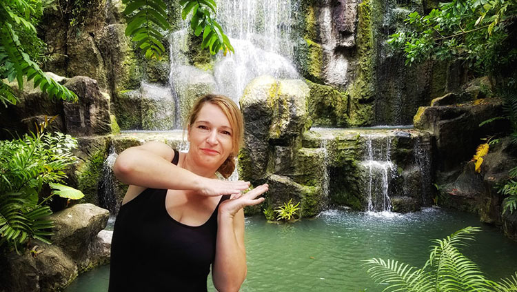 Helen Ryan - writer, world explorer. Shown at the Centara Grand Beach Resort Ao Nang waterfall in Krabi, Thailand.