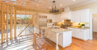 Two images blended together—the left side features the framing of a home, while the right is a completed kitchen renovation.