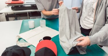 A team in an advertising agency discusses various promotional items to use in their marketing strategy.