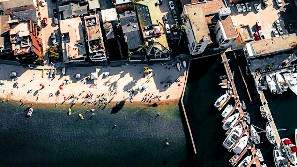Aerial view of the dock, boats, and sandy beach in Long Beach Aerial view of the dock, boats, and sandy beach in Long Beach