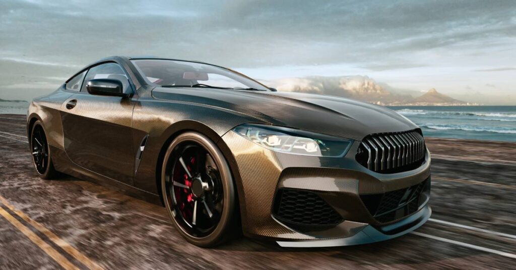 A sleek, freshly wax and polished vehicle cruising down the street. The paint color is a metallic brown.