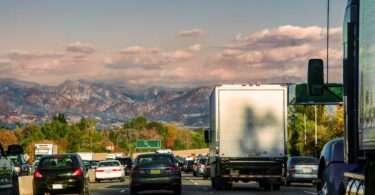 A driver's perspective of traffic in Los Angeles, California with the Transverse Ranges visible in the far distance.