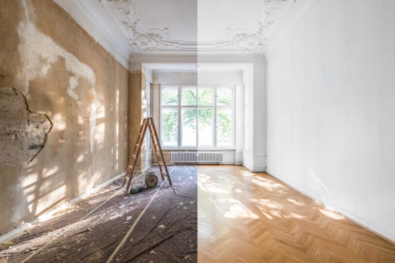 A room is split down the middle of the frame; the left half of the room is unfinished while the right half is fully finished.